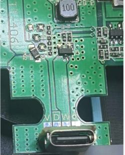 Image of a green printed circuit board with electronic components and a USB-C port.