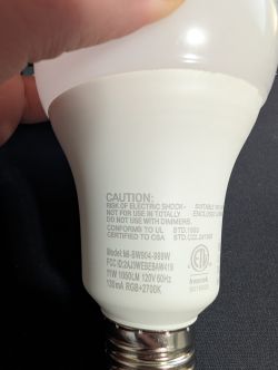 Close-up of an LED bulb with markings on the casing.