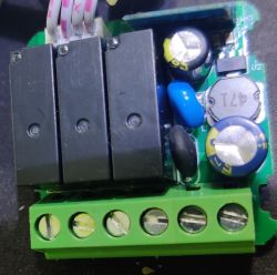 Close-up of a PCB with various electronic components and wires.