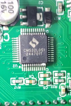 CMS32L051 microcontroller mounted on a green PCB circuit board