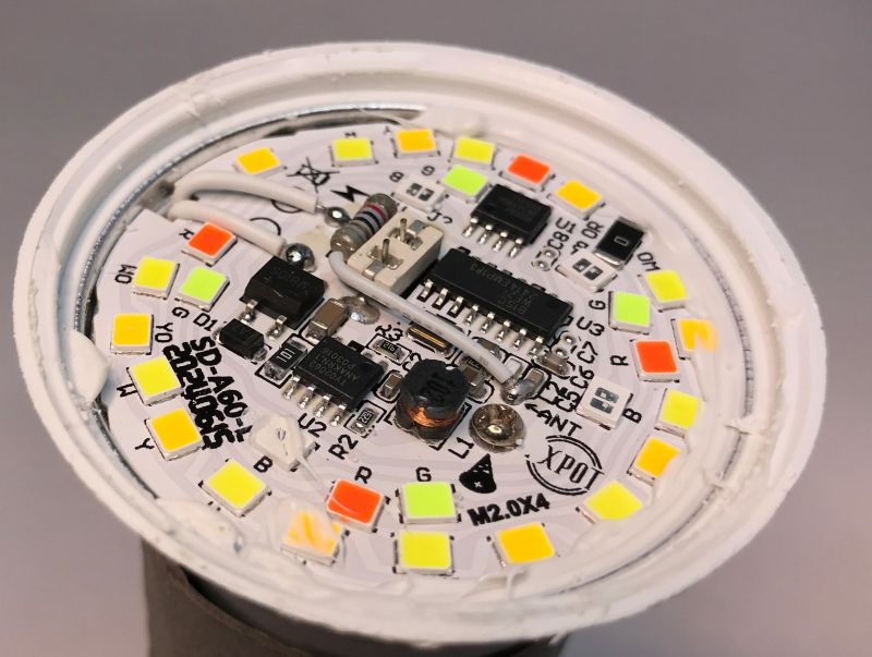 Inside of RGB/CCT Smart LED Bulb Interior of a smart LED bulb showing electronic circuits and components.