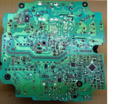 Printed circuit board with marked faulty components.