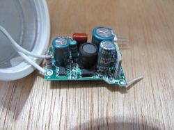 Printed Circuit Board with Electronic Components Printed circuit board with electronic components on a wooden table.