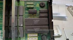 Close-up of a PCB with ICs and an edge connector, including FP2800A chips