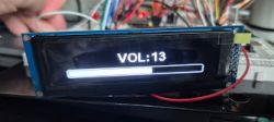 LCD display showing volume level 13 on a slider.