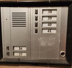 Intercom panel with buttons and apartment numbers 36-41.