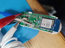 PCB with components and alligator clips.