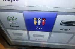 TV input selection menu with AV2 highlighted and RCA connector icons