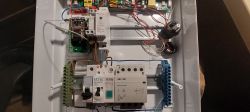 Interior of an electrical cabinet with relays, contactors, wires, and a YINGJIAO switching power supply.