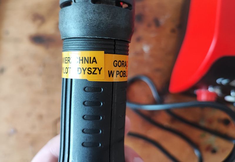 Yato Soldering Station Nozzle with Warning Close-up of the nozzle part of a Yato soldering station with a warning label.