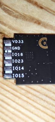Electronic Component with Connector Labels Close-up of an electronic component with visible connector labels: VD33, GND, IO18, IO23, IO14, IO15.