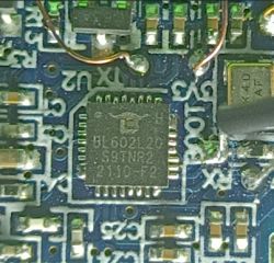 Close-up of BL602L20 chip on a blue PCB with visible wire connections