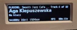 Music player display showing Smooth Jazz Cafe track information.