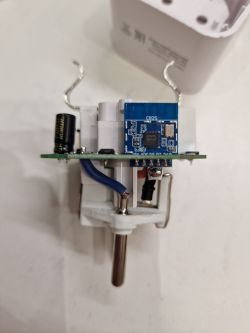 Interior of a smart plug with a CB2S module and electronic components.