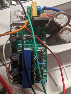 Close-up of a circuit board with CBU module and connected wires.
