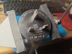 Tuya BSD29 Smart Plug in a Vice Tuya BSD29 smart plug in a vice with model markings visible.