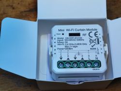 QS-WIFI-ECC02 Wi-Fi Curtain Controller in Package QS-WIFI-ECC02 Wi-Fi curtain controller in an open package.