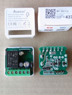 Disassembled Aubess power monitoring switch showing the casing and circuit boards.