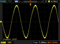 Sine Wave on Oscilloscope Oscilloscope displaying a sine wave with 241 V voltage.