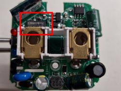 Image of the inside of a plug with a fuse highlighted in red.