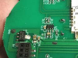 PCB Section with AMS1117 and RH6016C in SmartLED 8044 Switch Close-up of a green PCB section with AMS1117 3.3V voltage regulator, pin header, and RH6016C chip visible.