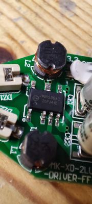 Close-up of a circuit board with electronic components, including a JWB1536AC integrated circuit.