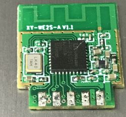 Close-up of an electronic module labeled XY-WE2S-A V1.1 with visible components and traces.