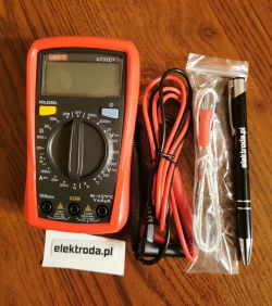 UNI-T UT33C+ multimeter with test leads, a pen and a lanyard on a wooden table