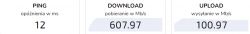 Wyniki testu prędkości Internetu pokazujące ping 12 ms, pobieranie 607.97 Mb/s, wysyłanie 100.97 Mb/s.