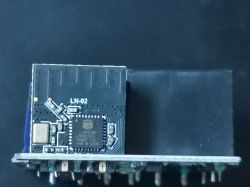 Close-up of an LN-02 integrated circuit on a black background.