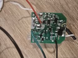 Close-up image of a circuit board with various electronic components and connected wires.