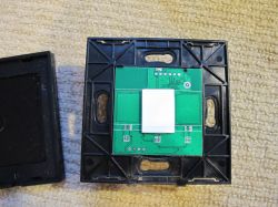 Close-up of a PCB in a housing Close-up of a printed circuit board with a green circuit mounted in a black housing.