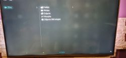Telewizor Philips 55PUS6754 z białymi punktami na ekranie.