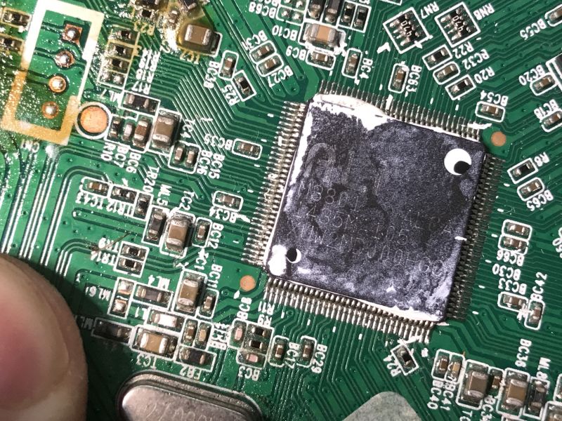 Close-up of M3801 chip on green PCB with various SMD components around it