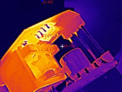 Thermal image of device internals; hottest spot 77.2°C, background about 21.4°C.