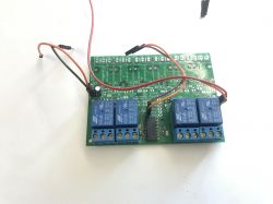 Circuit board with relays and wiring.