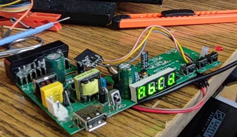 Electronic Board with Functioning LED Display Electronic board with an LED display showing AC:CA on a table.