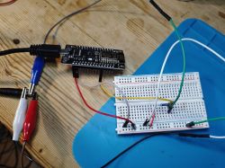 ESP8266 NodeMCU board connected to a breadboard with wires.