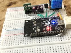 Dev board with various sensors on a breadboard.