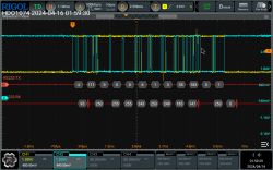 Screenshot from an oscilloscope showing RS232-TX and RS232-RX signal waveforms.