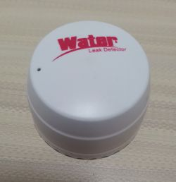 White water leak detector with red text Water Leak Detector on top.