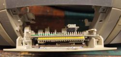Electronics board mounted in the cassette deck opening inside an audio device