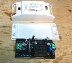Relay module with FL-S63-V1.0 casing on a wooden surface