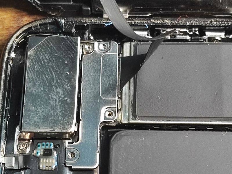 Interior of an iPhone Showing Battery and Components Interior of an opened iPhone during battery replacement