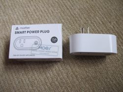 MOES Smart Plug with Box MOES smart power plug with power measurement next to the box.