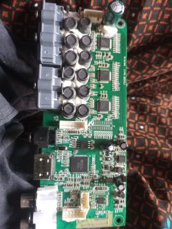 Close-up of a mainboard with various electronic components and ports.