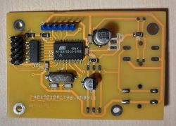Close-up of a PCB with ATtiny2313 microcontroller and electrolytic capacitors