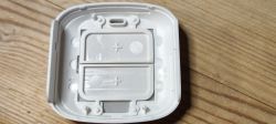 Interior of a plastic battery compartment showing slots for two AAA batteries.