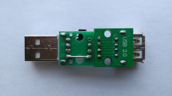 USB adapter with male and female connectors and voltage regulator circuit