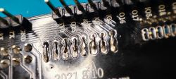 Close-up of a circuit board with numerous pins and soldered traces.
